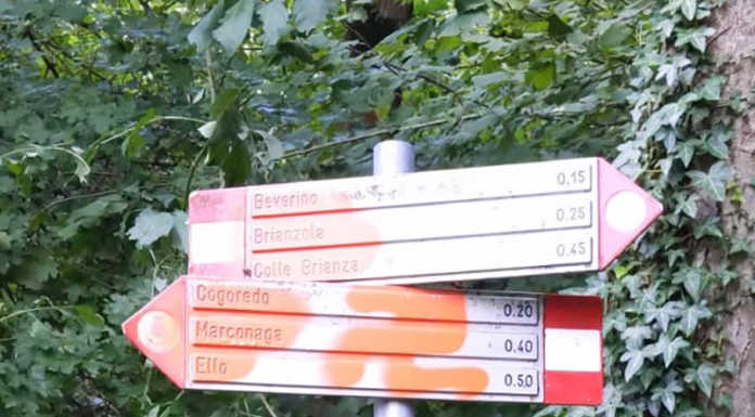 Dolzago, disegnata svastica sulla segnaletica dei sentieri